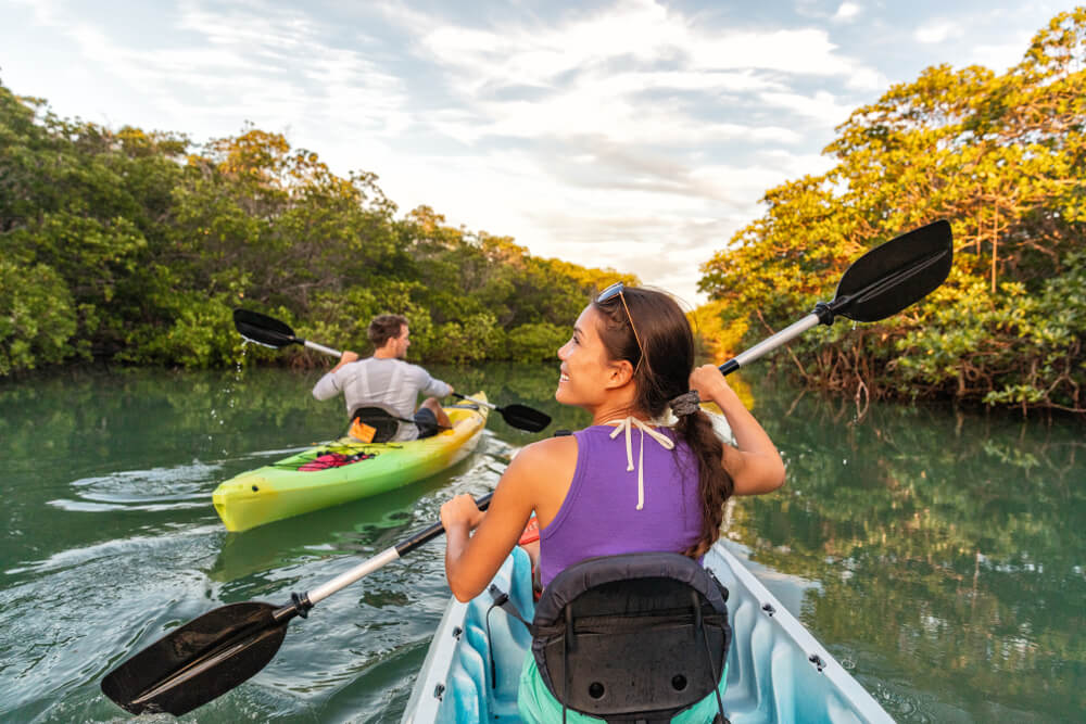 A couple kayaking on a winter vacation in Gulfport, Florida.