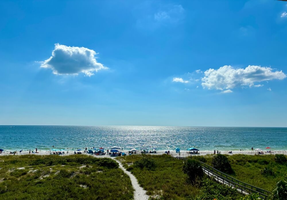 People relaxing on the beach, one of the best things to do in Treasure Island, Florida.