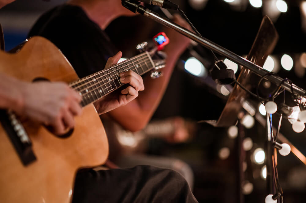 A person playing live music at a spot near Gulfport, Florida.